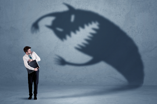 employee afraid of a monster-shaped shadow